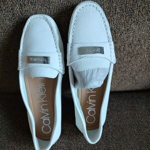 Women's Calvin Klein white loafers, Size 7.